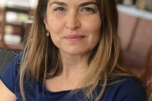 Headshot of Biljana Tutorov wearing a blue short sleeve shirt