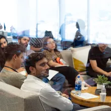 A group of Getting Real Fellows watches a panel at Getting Real 22. Image credit: Urbanite Media