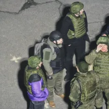 CCTV footage of a group of six Russian soldiers from above.